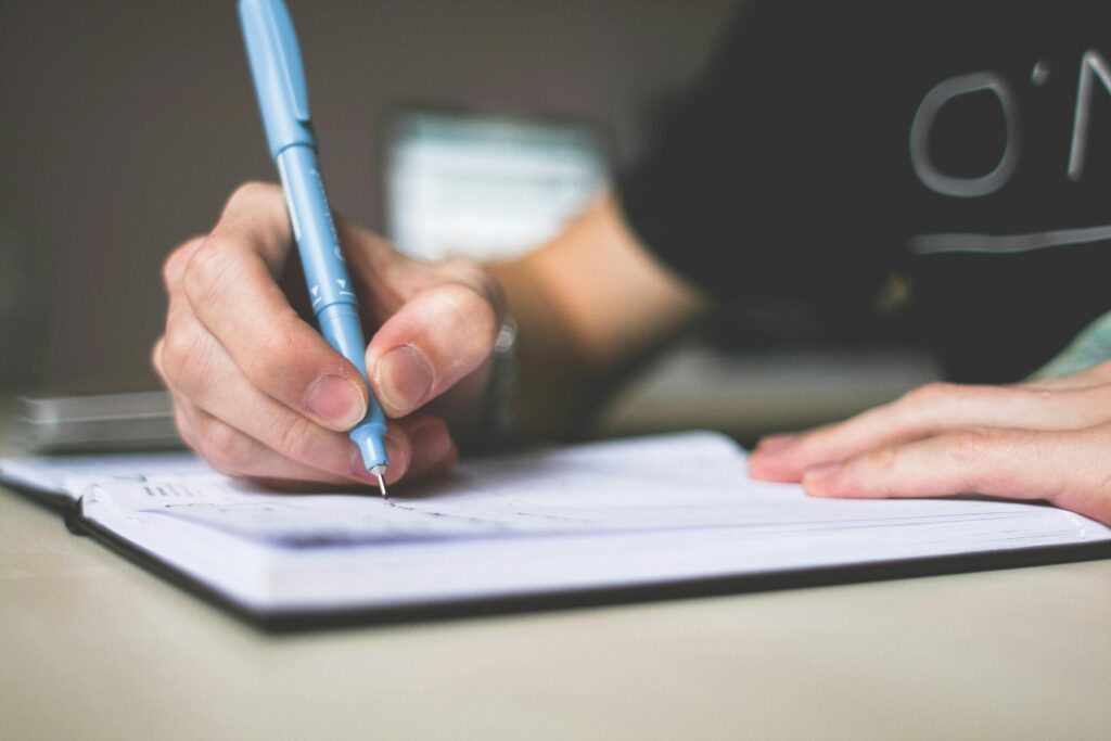 Man Writing Close Up Letter. This is to Symbolize Email Marketing to Your Contacts